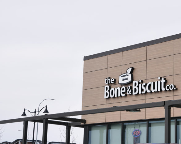 The Bone & Biscuit Co. sign on the exterior of their building.