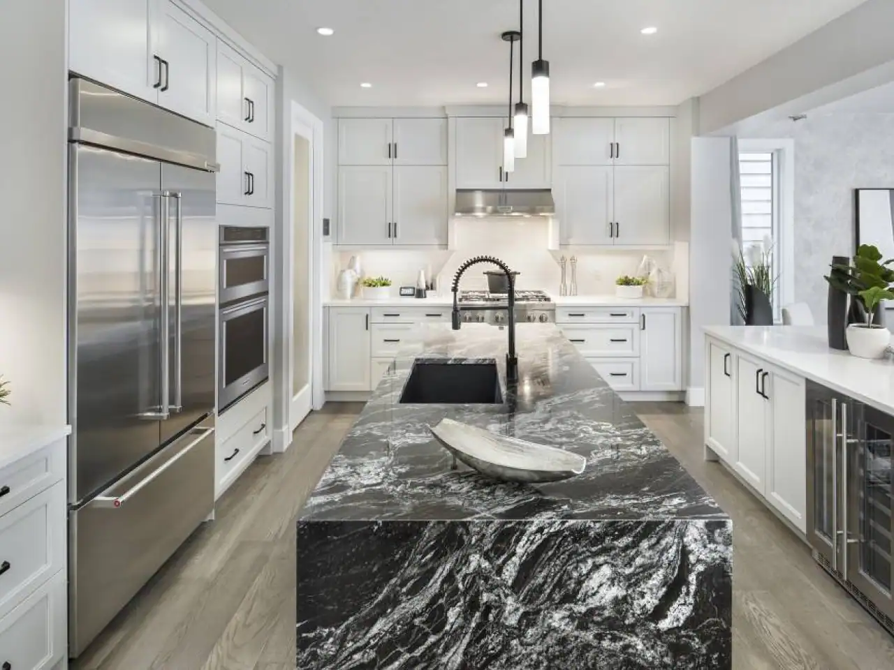 Newly designed kitchen featuring modern appliances, sleek cabinetry, and pristine countertops, embodying a fresh and contemporary culinary space.