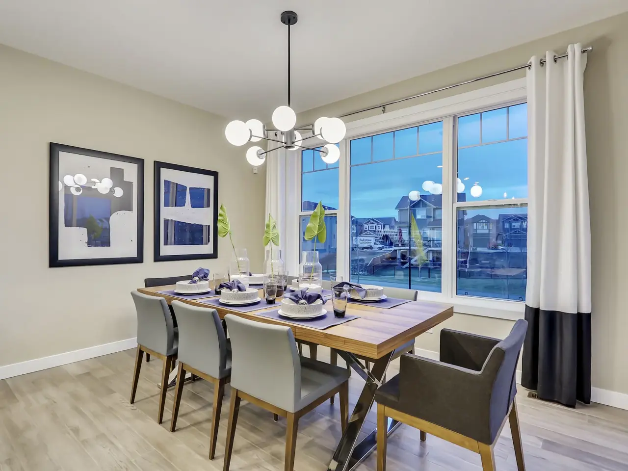 Elegant dining room with a tastefully set table, stylish furniture, and soft ambient lighting, creating a welcoming and sophisticated atmosphere for meals and gatherings.