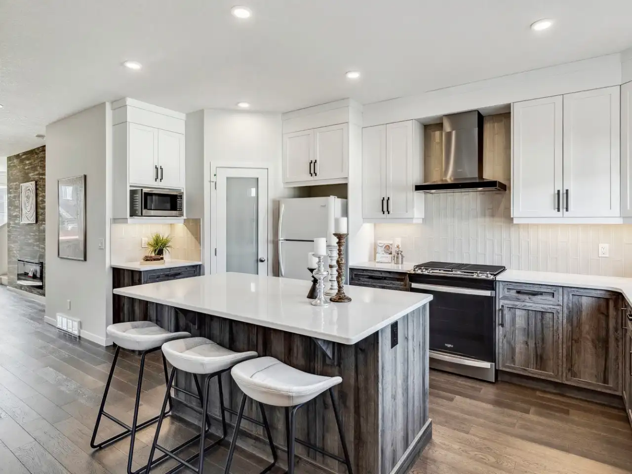 Bright and modern kitchen with stainless steel appliances, new countertops, and a welcoming ambiance, perfect for cooking and socializing in a contemporary home.