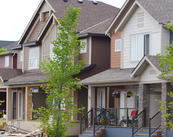 The front elevations of two duplexes in Wolf Willow.