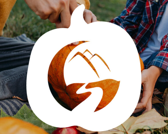 The WestCreek logo over a photo of two people carving a pumpkin.