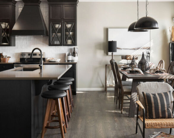 kitchen with dark cabinets, stainless steel appliances, and dining area