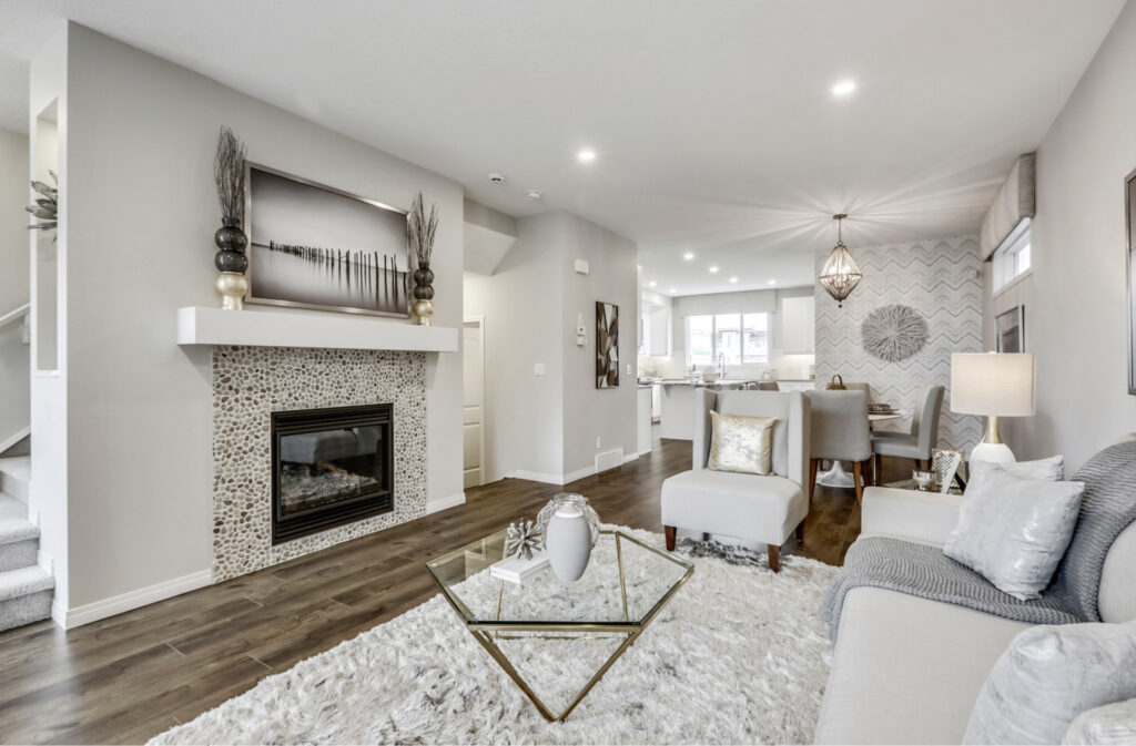 cozy living room in the trico rowan home with a white and grey color scheme