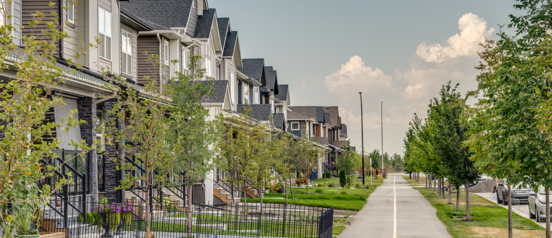 A row of townhomes next to a bike path in Wolf Willow.